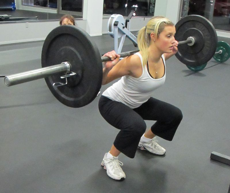 Back squat girl How To squat Using a squat rack or Smith machine adjust an